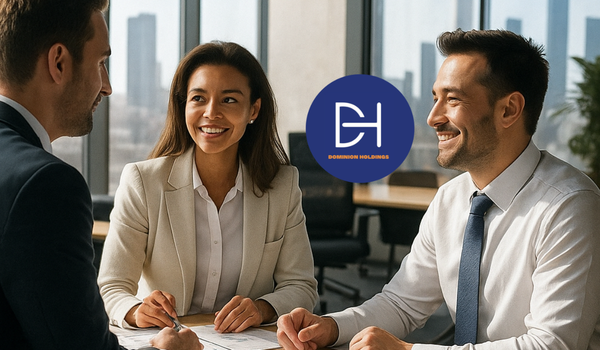 Business team discussing psychometric assessments at a conference table in a bright modern office with city views