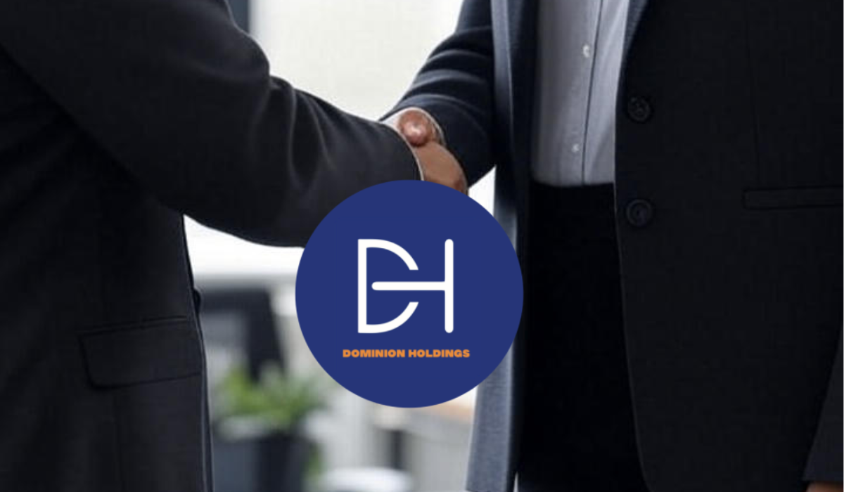 Two professionals in business attire shaking hands in an office setting with a window and plants, symbolizing a successful agreement or hire supported by psychometric assessments.